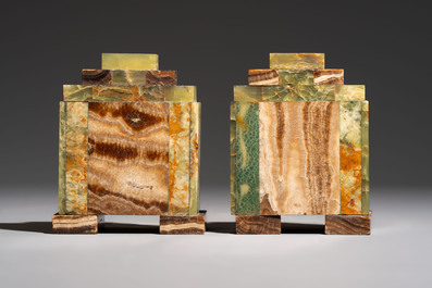 Georges Lavroff (1895&ndash;1991): An Art Deco three-piece copper-alloy-mounted green and brown onyx mantelpiece garniture, ca. 1900