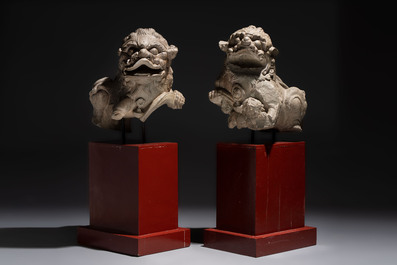 A pair of Chinese carved stone Buddhist lions on later red-lacquered wooden stands, Fujian, Qing