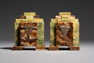 Georges Lavroff (1895&ndash;1991): An Art Deco three-piece copper-alloy-mounted green and brown onyx mantelpiece garniture, ca. 1900