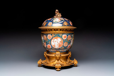 Two Japanese Imari covered bowls, one mounted in silver and wood and the other with gilt-bronze mounts, Meiji, 19th C.