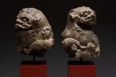 A pair of Chinese carved stone Buddhist lions on later red-lacquered wooden stands, Fujian, Qing