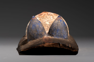 A polychromed wooden fertility belly mask from the Yoruba people, West Africa, 20th C.