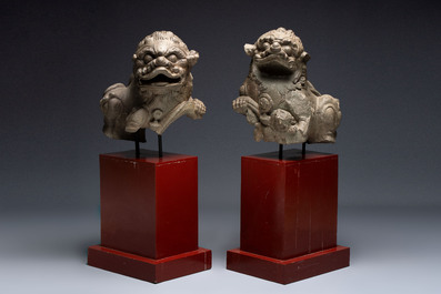 A pair of Chinese carved stone Buddhist lions on later red-lacquered wooden stands, Fujian, Qing