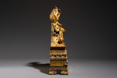A gilt-bronze 'Oriental Beauty Reclining on a Lion Skin' mantel clock, France, first quarter 19th C.