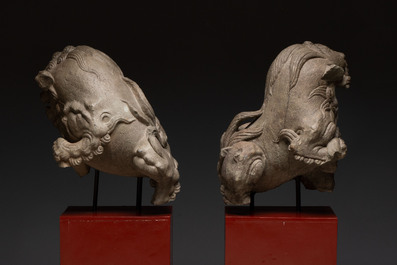 A pair of Chinese carved stone Buddhist lions on later red-lacquered wooden stands, Fujian, Qing