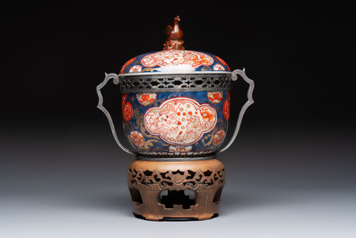 Two Japanese Imari covered bowls, one mounted in silver and wood and the other with gilt-bronze mounts, Meiji, 19th C.