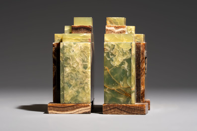 Georges Lavroff (1895&ndash;1991): An Art Deco three-piece copper-alloy-mounted green and brown onyx mantelpiece garniture, ca. 1900