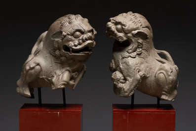 A pair of Chinese carved stone Buddhist lions on later red-lacquered wooden stands, Fujian, Qing