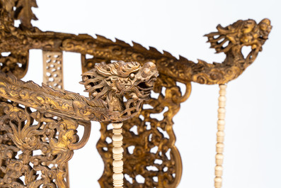 An exceptional Vietnamese gilt-lacquered wood and ivory 'Dragon and Phoenix' throne-shaped altar, 18/19th C.