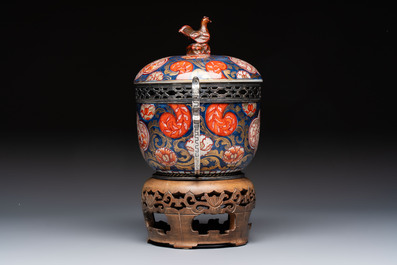 Two Japanese Imari covered bowls, one mounted in silver and wood and the other with gilt-bronze mounts, Meiji, 19th C.