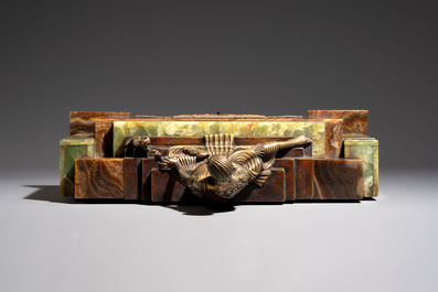 Georges Lavroff (1895&ndash;1991): An Art Deco three-piece copper-alloy-mounted green and brown onyx mantelpiece garniture, ca. 1900