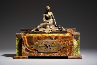 Georges Lavroff (1895&ndash;1991): An Art Deco three-piece copper-alloy-mounted green and brown onyx mantelpiece garniture, ca. 1900