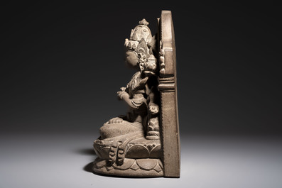 A Javanese carved stone figure of Prajnaparamita, 20th C.