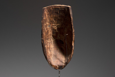 A polychromed wooden fertility belly mask from the Yoruba people, West Africa, 20th C.