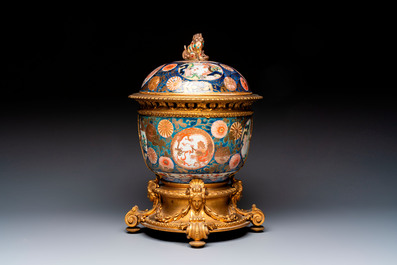 Two Japanese Imari covered bowls, one mounted in silver and wood and the other with gilt-bronze mounts, Meiji, 19th C.