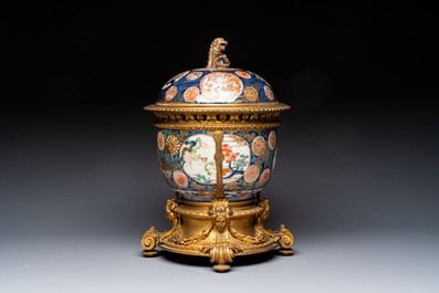 Two Japanese Imari covered bowls, one mounted in silver and wood and the other with gilt-bronze mounts, Meiji, 19th C.