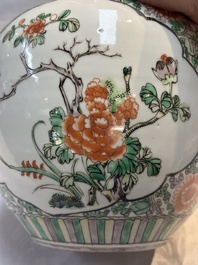 A pair of Chinese famille verte 'Floral' jars with wooden covers, 19th C.