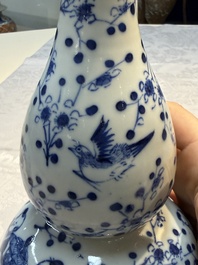 Three Chinese blue and white vases, one covered, Kangxi mark, 19th C. and later