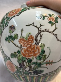 A pair of Chinese famille verte 'Floral' jars with wooden covers, 19th C.