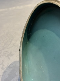 A pair of Chinese turquoise-glazed ducks and a pair of verte biscuit quail-form covered boxes, 20th C.
