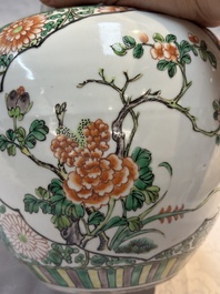 A pair of Chinese famille verte 'Floral' jars with wooden covers, 19th C.
