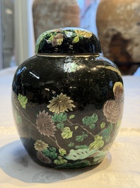 A Chinese verte biscuit black-ground vase and a covered jar, Xuande and Kangxi mark, 19th C.