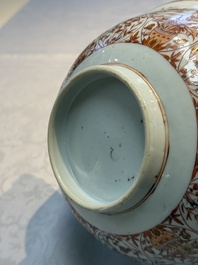 A pair of Chinese  iron-red and gilt-decorated 'Elegant Ladies and Tulips' bowls and covers, Kangxi