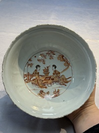 A pair of Chinese  iron-red and gilt-decorated 'Elegant Ladies and Tulips' bowls and covers, Kangxi