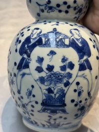 Three Chinese blue and white vases, one covered, Kangxi mark, 19th C. and later