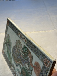 A Chinese famille verte 'Buddhist Lions' plaque, 19th C.