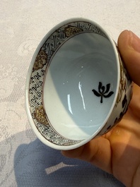A Chinese gilt-decorated black-enamelled 'Antiquities' cup, Yongzheng/Qianlong