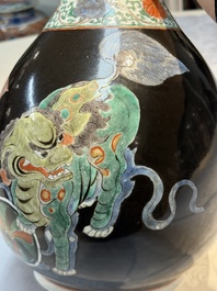 A rare Chinese famille verte black- and ruby-ground 'Buddhist Lions' vase, Kangxi