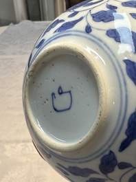 A rare Chinese 'G-marked' blue and white bottle vase with floral design, Kangxi