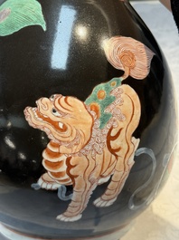 A rare Chinese famille verte black- and ruby-ground 'Buddhist Lions' vase, Kangxi