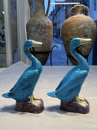 A pair of Chinese turquoise-glazed ducks and a pair of verte biscuit quail-form covered boxes, 20th C.
