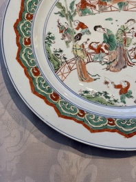 A Chinese famille verte 'Elegant Ladies and Playing Boys' dish, Chenghua mark, Kangxi