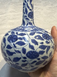 A rare Chinese 'G-marked' blue and white bottle vase with floral design, Kangxi