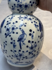 Three Chinese blue and white vases, one covered, Kangxi mark, 19th C. and later