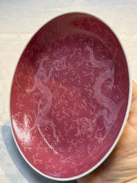 Four Chinese sgraffito ruby-ground 'Dragon' cups and three plates, Qianlong mark, Republic