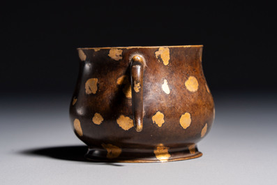 A Chinese gold-splashed bronze censer with two handles, Xuande mark, 18th C.