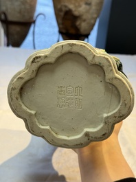 A Chinese verte biscuit black-ground vase and a covered jar, Xuande and Kangxi mark, 19th C.