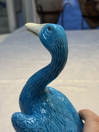 A pair of Chinese turquoise-glazed ducks and a pair of verte biscuit quail-form covered boxes, 20th C.