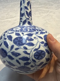 A rare Chinese 'G-marked' blue and white bottle vase with floral design, Kangxi