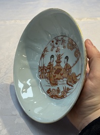 A pair of Chinese  iron-red and gilt-decorated 'Elegant Ladies and Tulips' bowls and covers, Kangxi