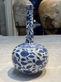 A rare Chinese 'G-marked' blue and white bottle vase with floral design, Kangxi