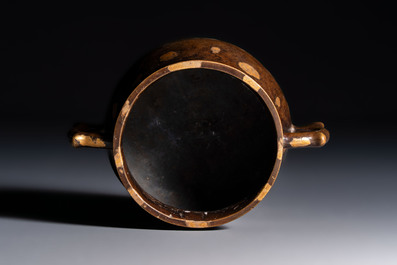 A Chinese gold-splashed bronze censer with two handles, Xuande mark, 18th C.