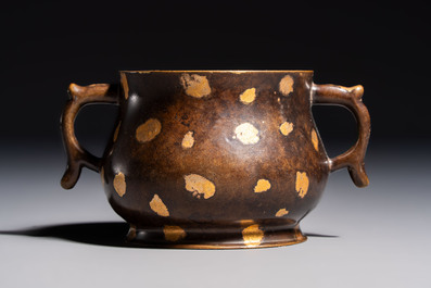 A Chinese gold-splashed bronze censer with two handles, Xuande mark, 18th C.