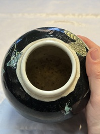 A Chinese verte biscuit black-ground vase and a covered jar, Xuande and Kangxi mark, 19th C.