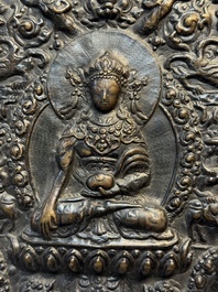 Three Tibetan copper repouss&eacute; plaques with Buddhist subjects, 19th C.