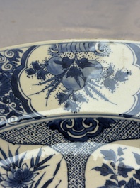 A pair of large Chinese blue and white 'Peacock Border' chargers with floral design, Kangxi